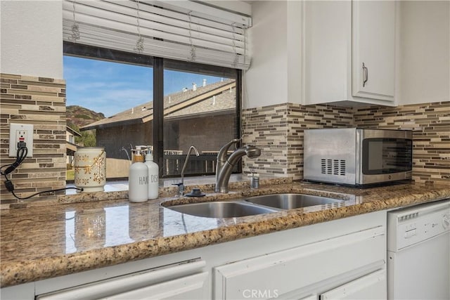 1758 Pala Lake Dr, Fallbrook, CA 92028 - kitchen with white dishwasher, stainless steel microwave, white cabinetry, backsplash, and stone counters