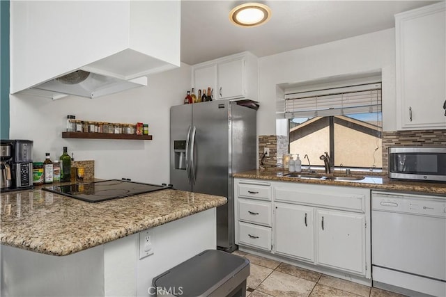 kitchen with sink, white cabinets, extractor fan, and appliances with stainless steel finishes