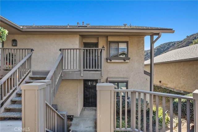 1758 Pala Lake Dr, Fallbrook, CA 92028 - property entrance with stucco siding, a mountain view, and a balcony