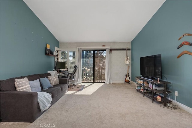 carpeted living room with lofted ceiling