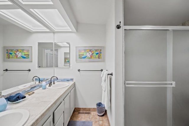 bathroom with vanity and an enclosed shower