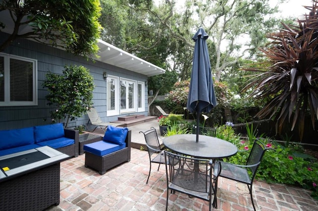 view of patio / terrace featuring an outdoor living space and french doors