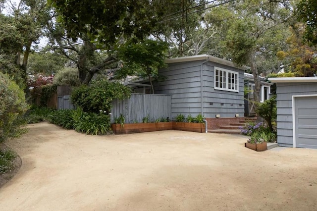 view of property exterior featuring a garage