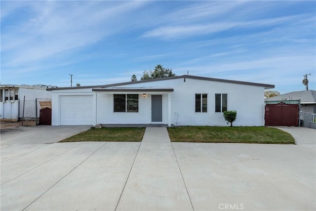 single story home with a front lawn and a garage