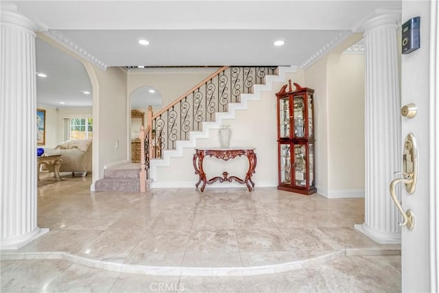 entryway featuring ornate columns