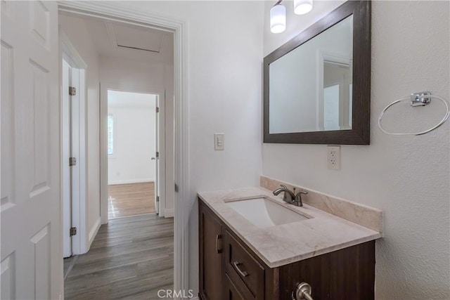 bathroom featuring vanity and hardwood / wood-style flooring