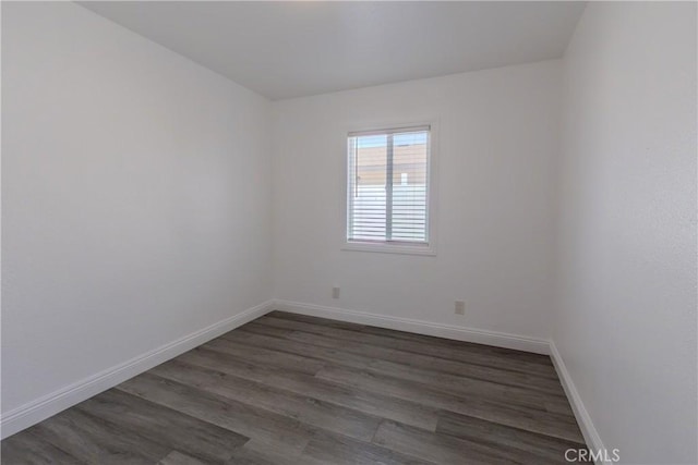 empty room featuring dark hardwood / wood-style flooring