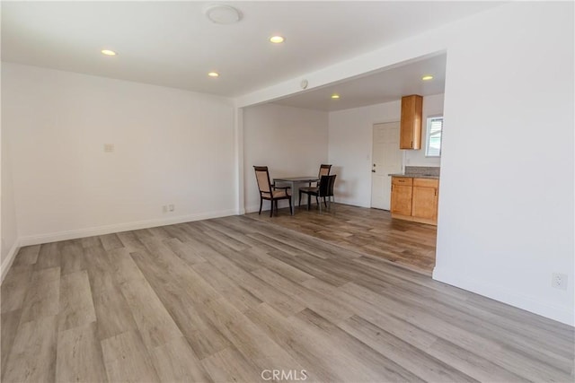 spare room featuring light wood-type flooring