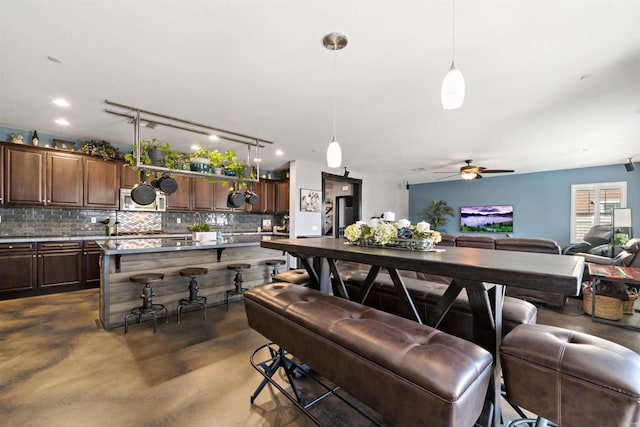 interior space featuring ceiling fan