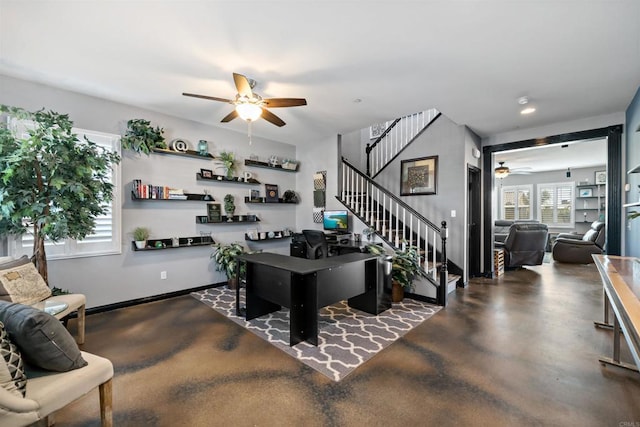 office area with ceiling fan and concrete floors