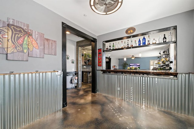 bar with concrete flooring