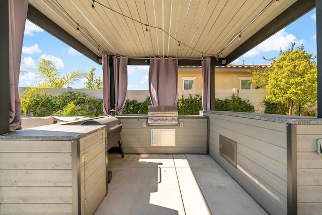 view of patio / terrace with an outdoor kitchen and area for grilling