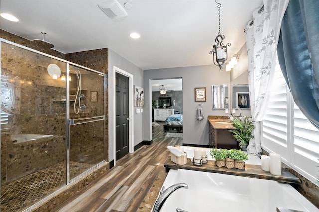 bathroom with vanity, an enclosed shower, ceiling fan, and wood-type flooring