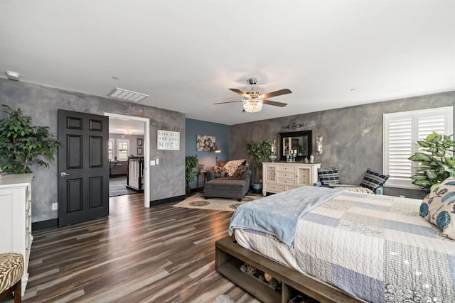 bedroom featuring ceiling fan and dark wood-type flooring