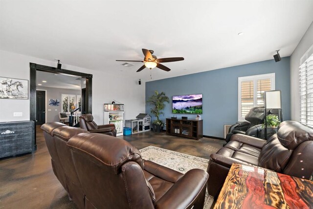 30343 Mahogany St, Murrieta, CA 92563 - living area featuring visible vents, ceiling fan, concrete flooring, and a barn door