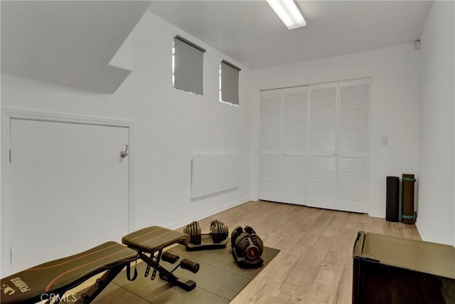 workout area featuring light wood-type flooring