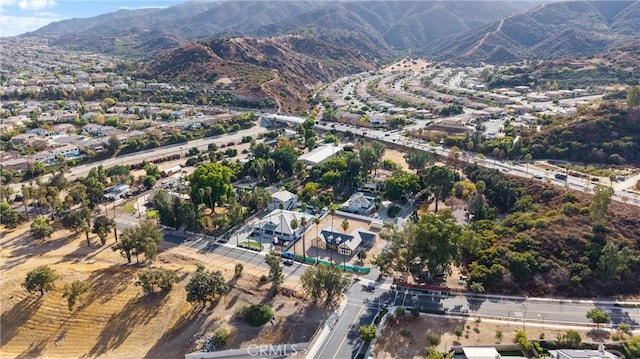 drone / aerial view featuring a mountain view