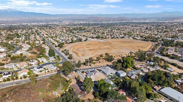 birds eye view of property with a mountain view