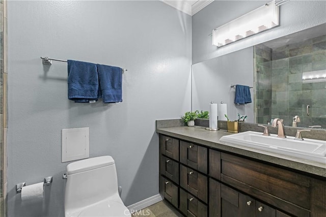 bathroom with vanity, toilet, an enclosed shower, and ornamental molding