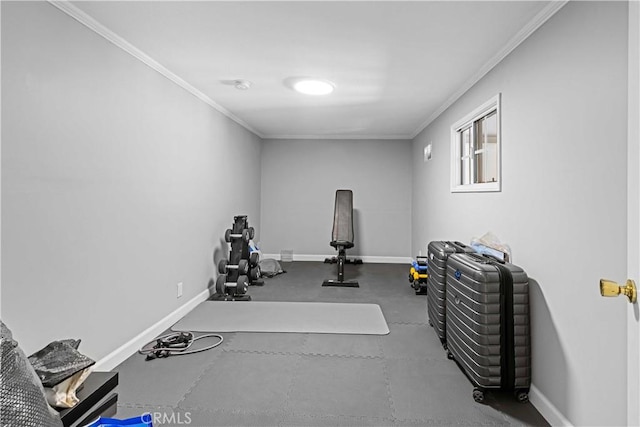 exercise room featuring crown molding