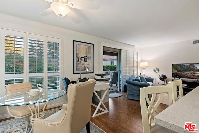 dining space featuring dark hardwood / wood-style floors and ceiling fan