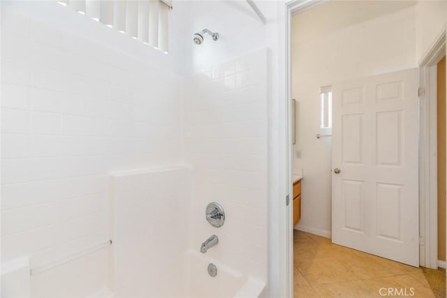 bathroom with tile patterned flooring, shower / bath combination, and vanity