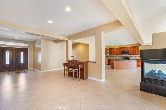 kitchen featuring decorative backsplash and a breakfast bar area