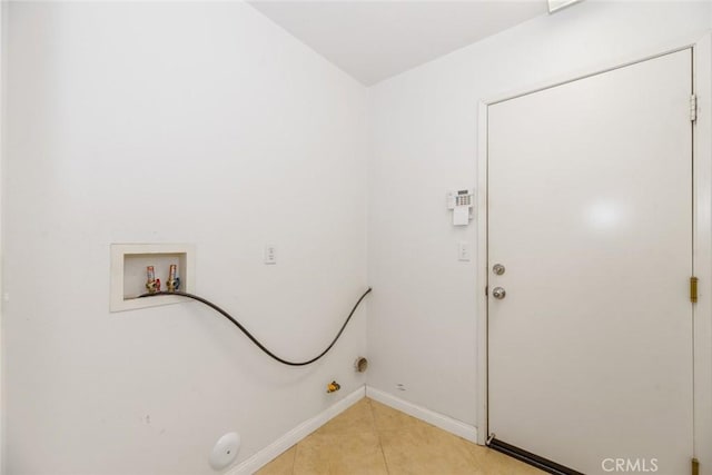 washroom featuring light tile patterned floors, hookup for a washing machine, and hookup for a gas dryer