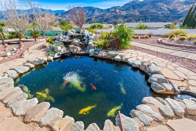 view of swimming pool featuring a mountain view