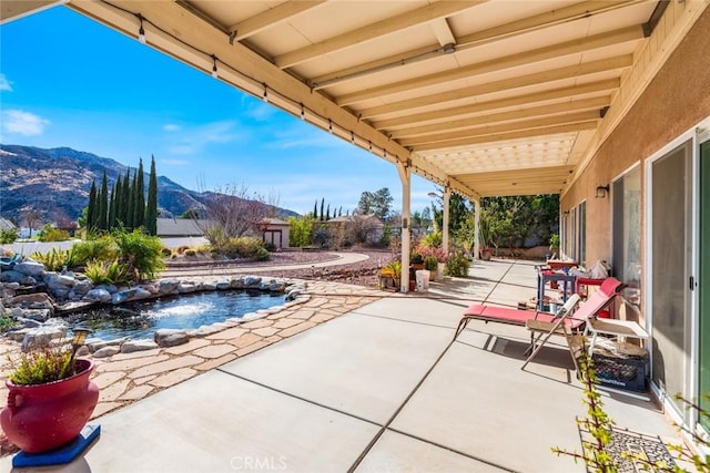 view of patio featuring a mountain view