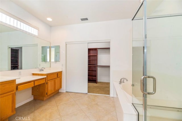 bathroom with vanity, independent shower and bath, and tile patterned flooring