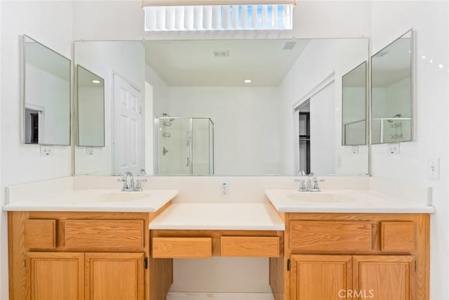 bathroom with vanity and an enclosed shower