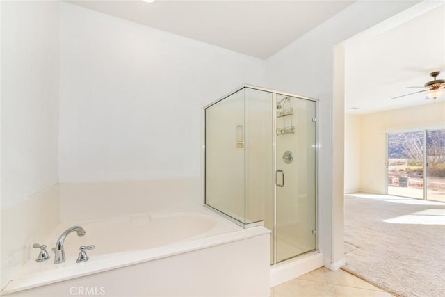 bathroom featuring ceiling fan, tile patterned floors, and plus walk in shower