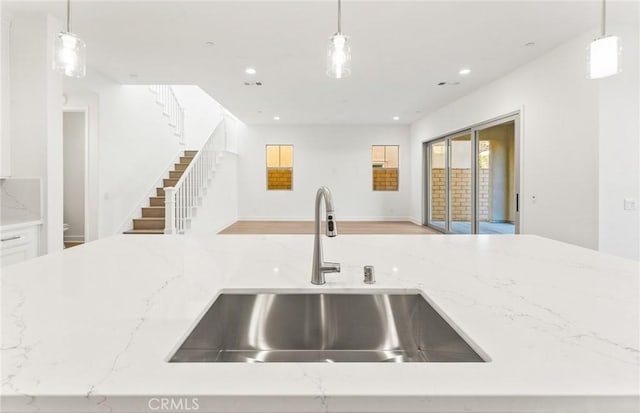 21235 Wildflower Way, Chatsworth, CA 91311 - kitchen with open floor plan, light stone countertops, decorative light fixtures, and recessed lighting