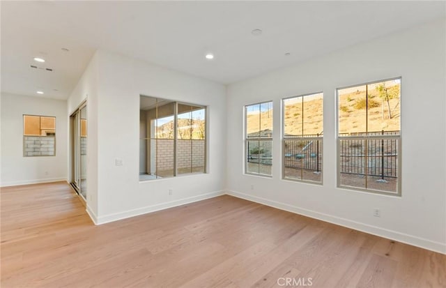 21235 Wildflower Way, Chatsworth, CA 91311 - unfurnished room with light wood-style floors and recessed lighting