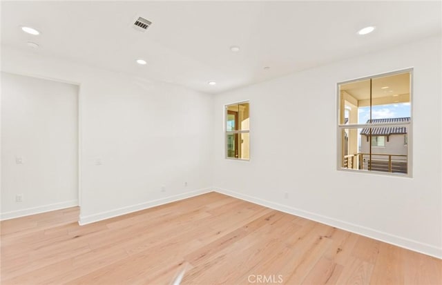 21235 Wildflower Way, Chatsworth, CA 91311 - empty room featuring light wood finished floors, healthy amount of natural light, and recessed lighting