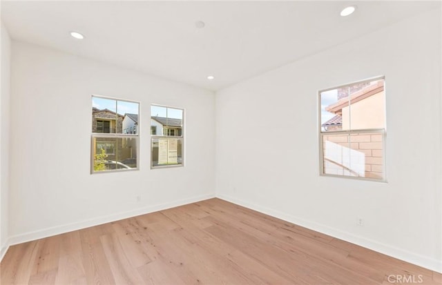 21235 Wildflower Way, Chatsworth, CA 91311 - unfurnished room featuring plenty of natural light, light wood-style floors, and recessed lighting