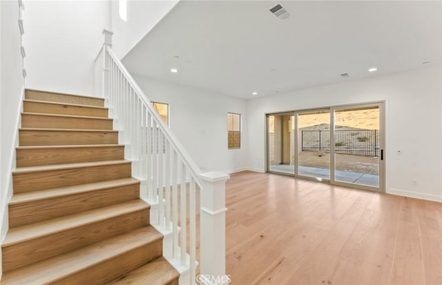 21235 Wildflower Way, Chatsworth, CA 91311 - stairway with recessed lighting and wood finished floors