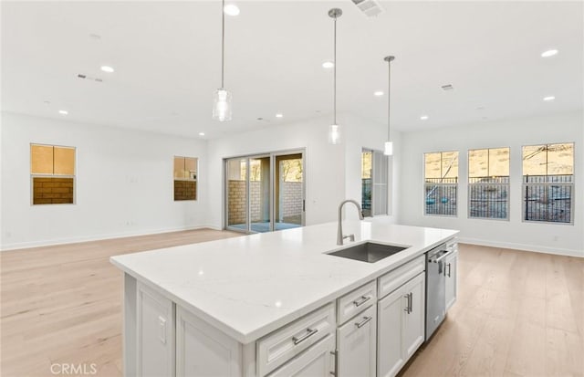 21235 Wildflower Way, Chatsworth, CA 91311 - kitchen with open floor plan, light wood-type flooring, stainless steel dishwasher, healthy amount of natural light, and recessed lighting