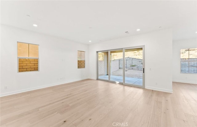 21235 Wildflower Way, Chatsworth, CA 91311 - spare room with light wood-style floors, healthy amount of natural light, and recessed lighting