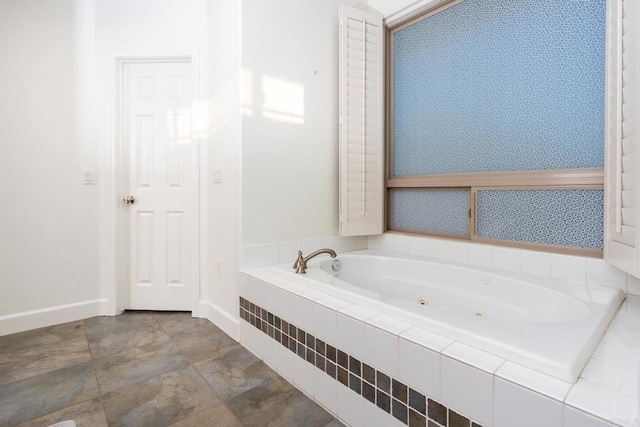 bathroom featuring a relaxing tiled tub