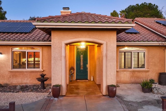 exterior entry at dusk with solar panels