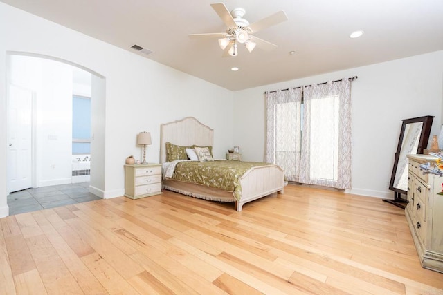 bedroom with ceiling fan and light wood-type flooring