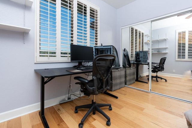 home office with hardwood / wood-style floors