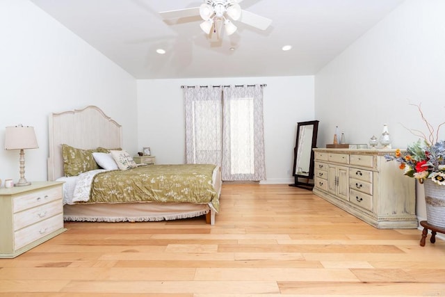 bedroom with light hardwood / wood-style floors and ceiling fan