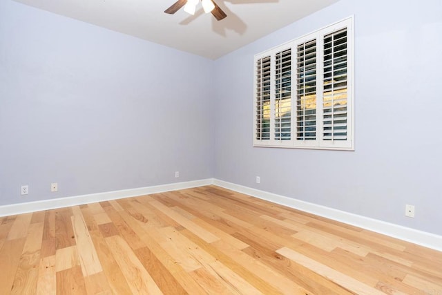 spare room featuring ceiling fan and hardwood / wood-style flooring