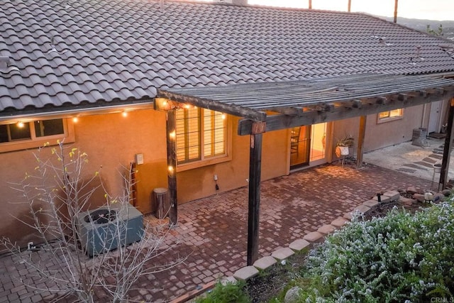 rear view of property featuring a patio