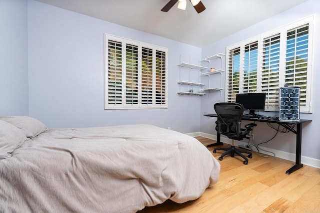 bedroom featuring hardwood / wood-style flooring and ceiling fan