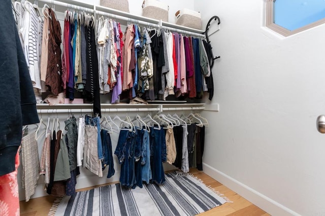 spacious closet with hardwood / wood-style floors