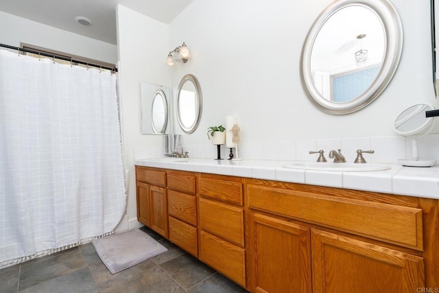 bathroom with vanity and a shower with shower curtain